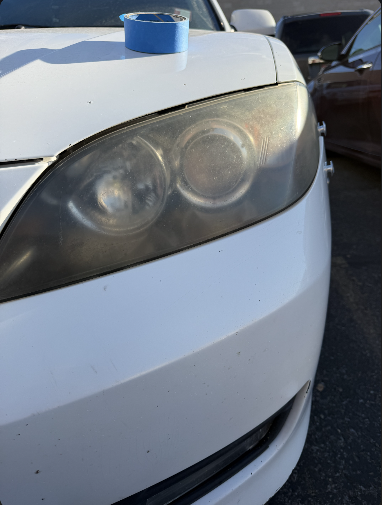 Cloudy, oxidized car headlight before restoration